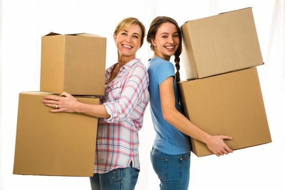 Mother and Daughter Moving boxes